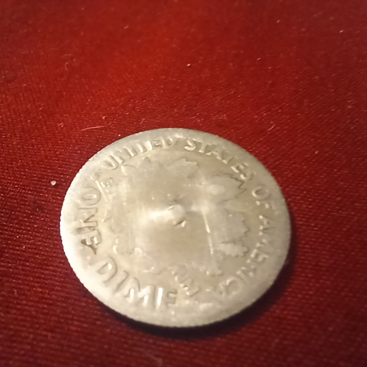 2012 Roosevelt dime lamination error showing clad layer peeling or separating from copper core